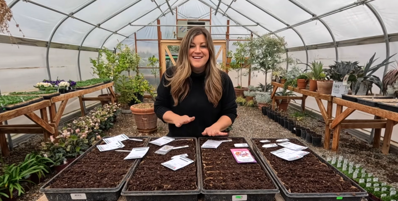 Laura happy in her garden planting new seeds
