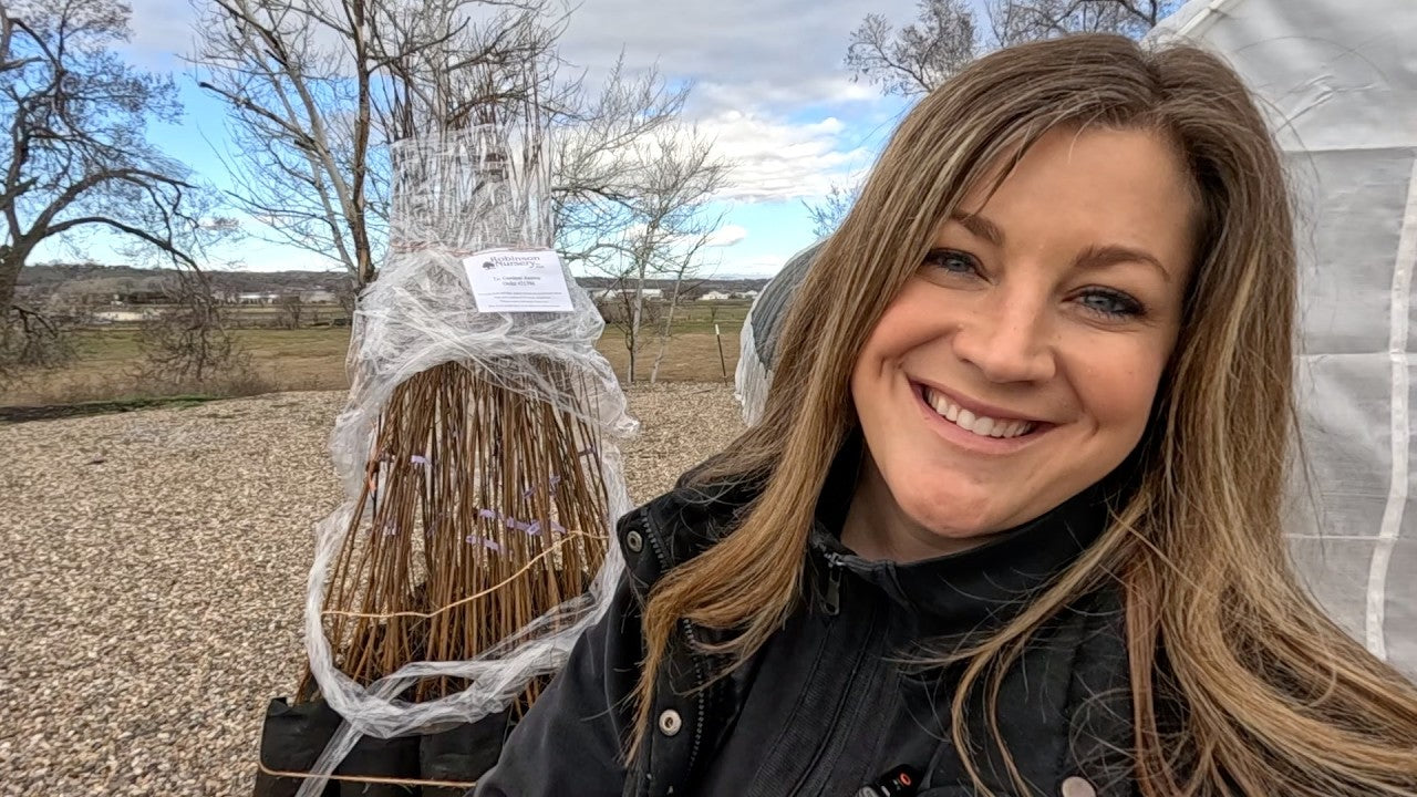 Laura smiling unboxing her birch tree