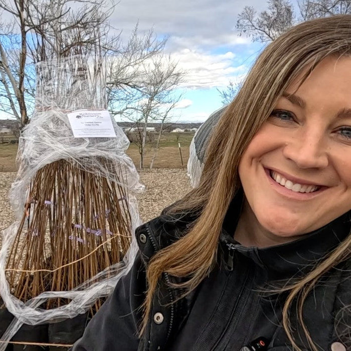 Laura smiling unboxing her birch tree