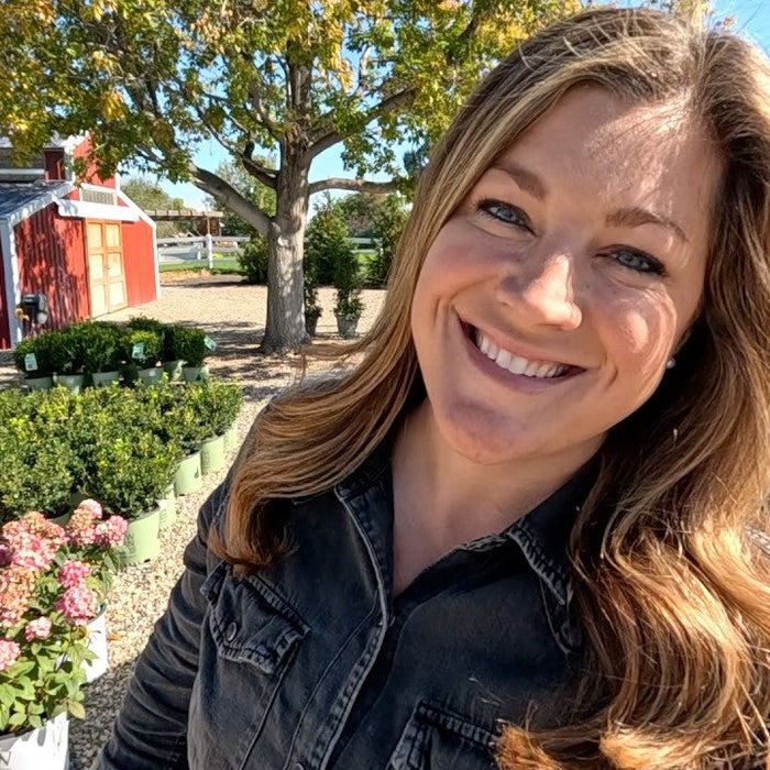 laura smiling outside the ranch