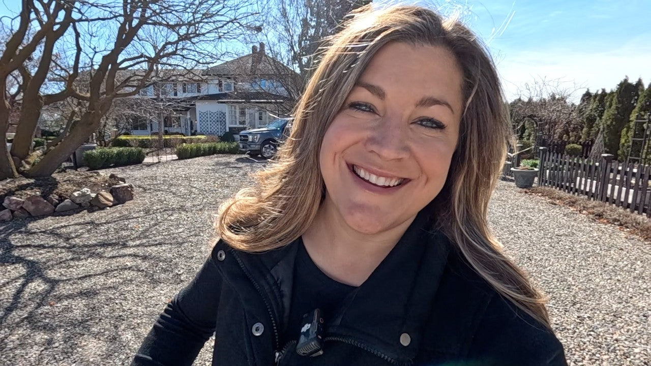 Laura smiling at her yard