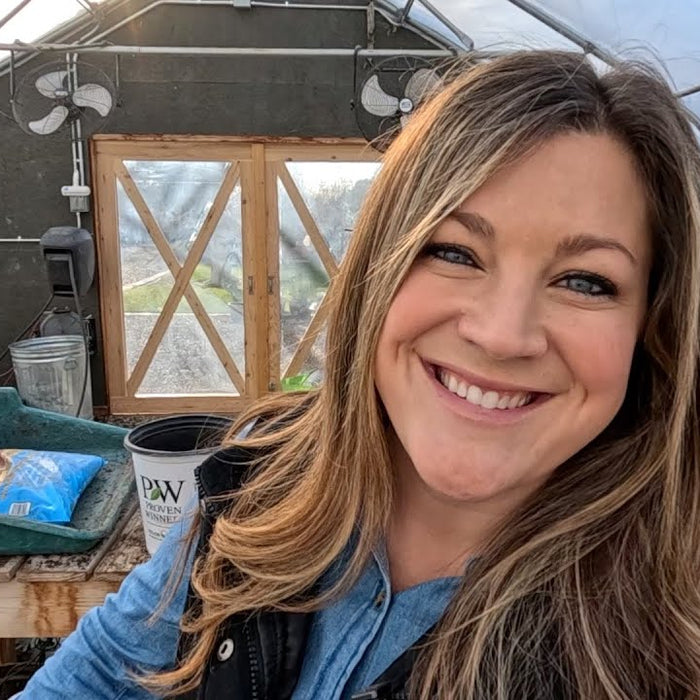 laura smiling in her garden house