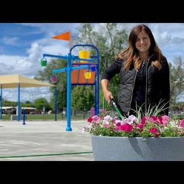 Planting Self-Watering Containers at Our City's New Splash Pad!