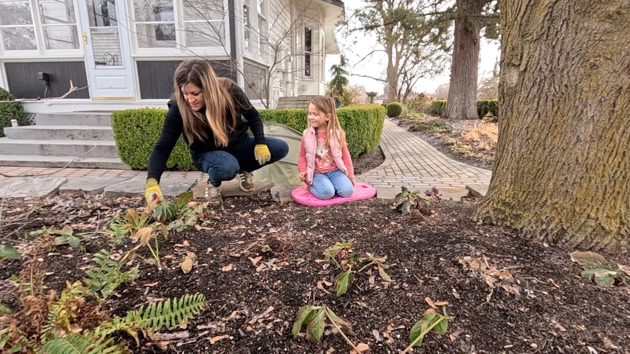 Laura with her daughter in the garden