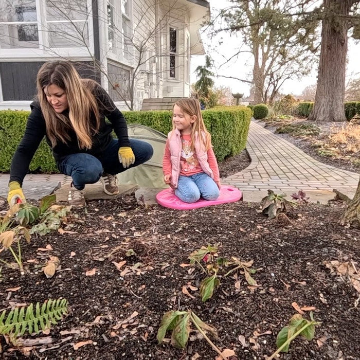 Laura with her daughter in the garden