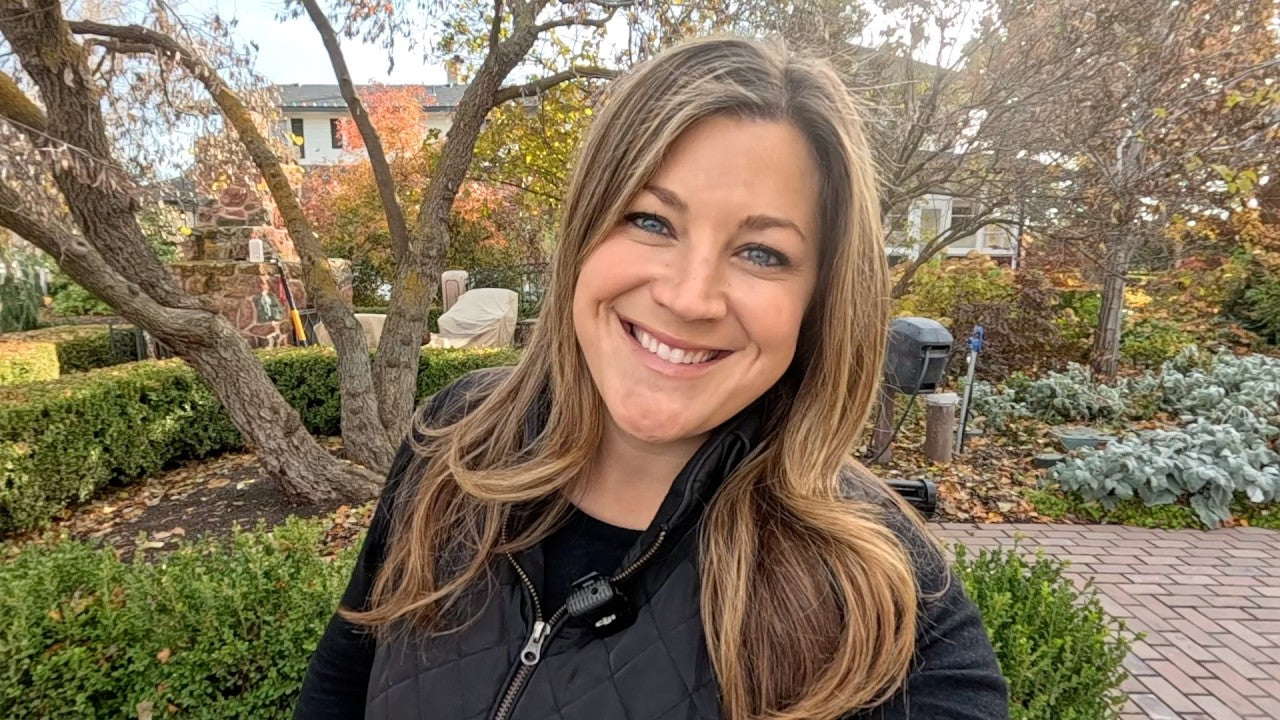 Laura in her backyard smiling