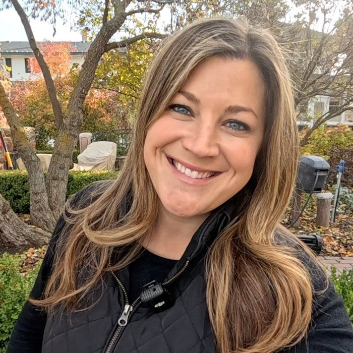 Laura in her backyard smiling