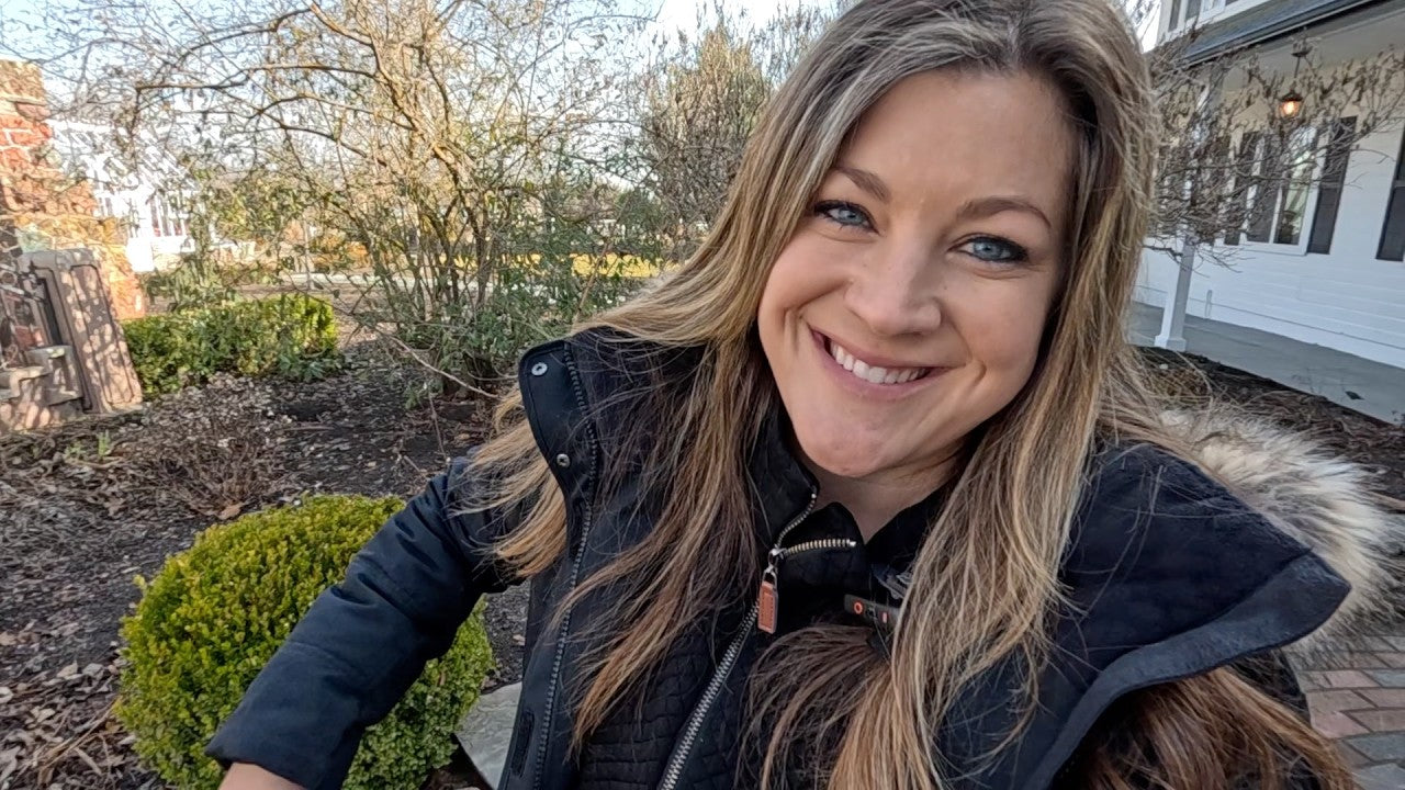 Laura behind wintery trees