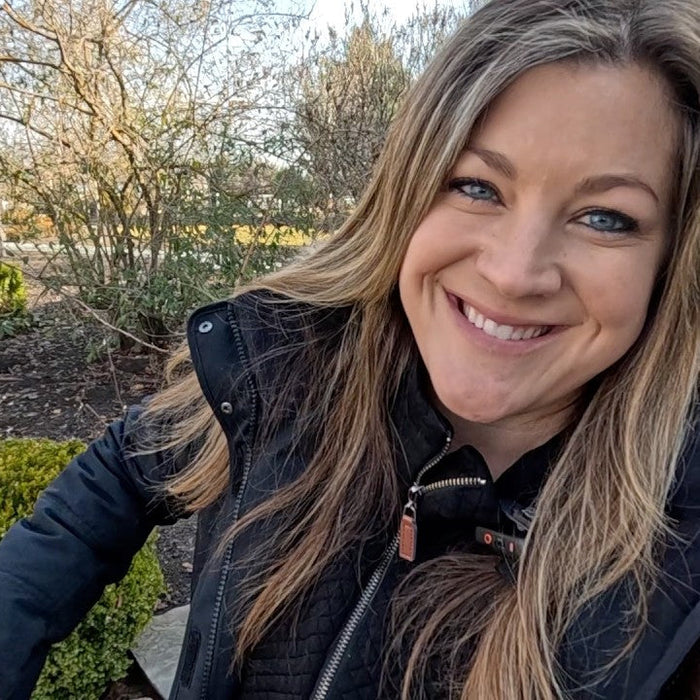 Laura behind wintery trees
