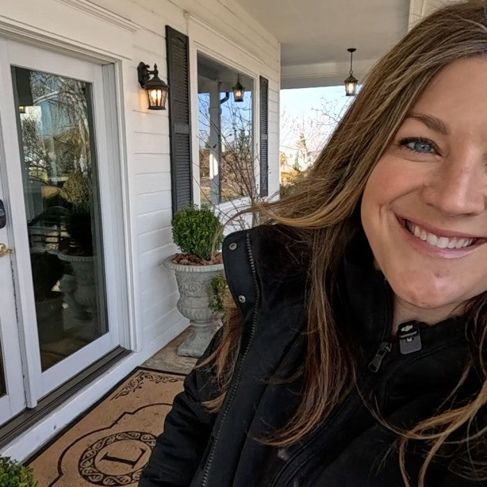 Laura smiling in her porch