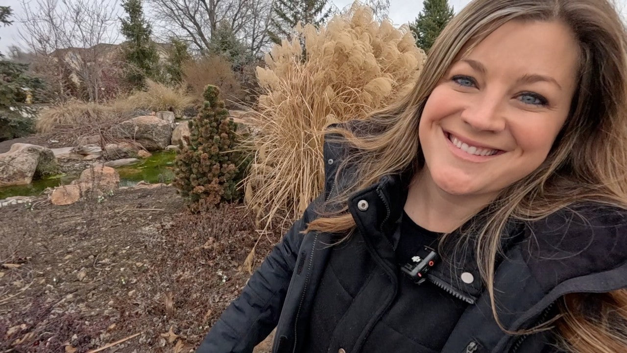 Laura smiling happy in her garden