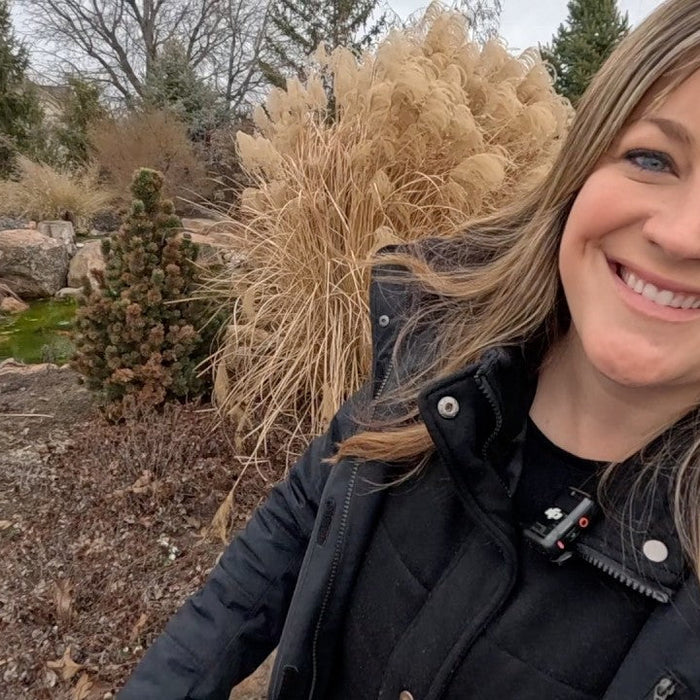 Laura smiling happy in her garden