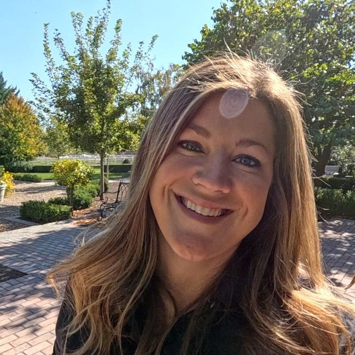 Laura smiling in her garden