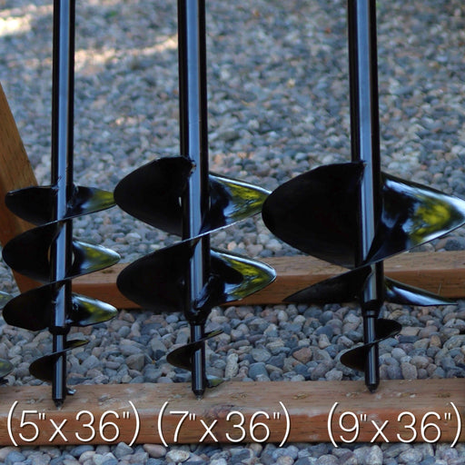 Three garden auger bits of different sizes on a gravel background