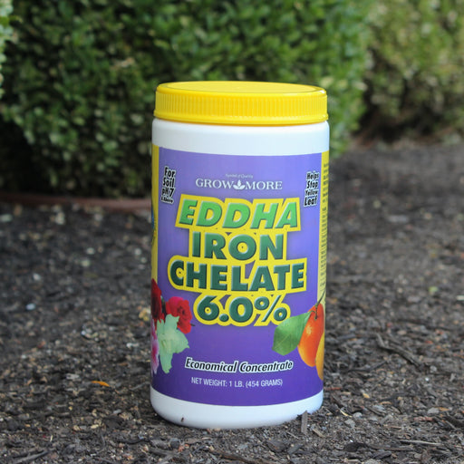 Grow More EDDHA Iron Chelate 6.0% container on a soil background