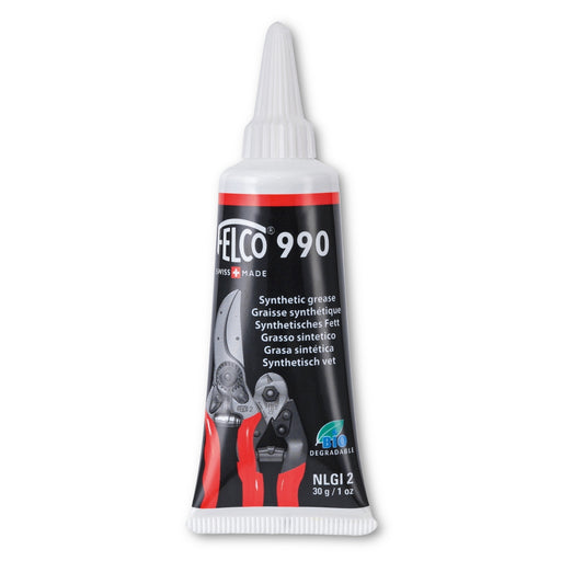 A tube of FELCO 990 grease, primarily black and white with red accents, designed for lubricating pruning shears.