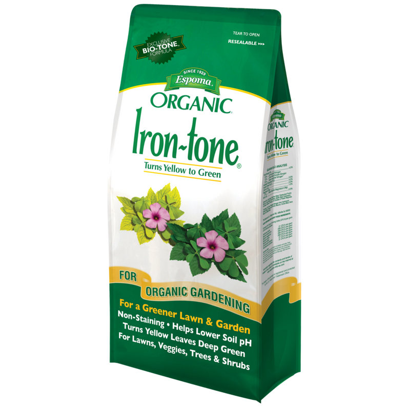 A bag of Espoma Organic Iron-Tone fertilizer, which is designed to turn yellow plants green. The bag is green and white with images of plants and flowers on it.