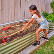 Child using a red hoe