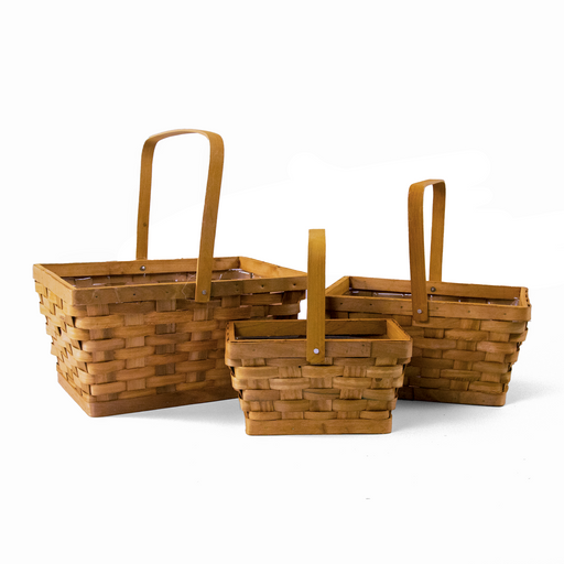 The Timeless Rectangular Basket Set includes three empty wooden baskets in varying sizes, each featuring upright handles and a charming woven design. Beautifully arranged on a white background, these baskets offer elegant decorative storage for any space.