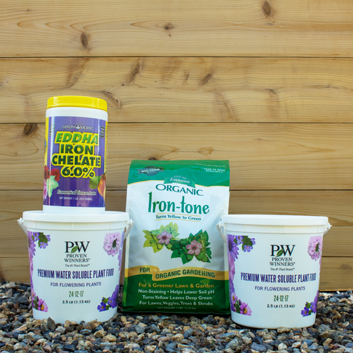 Four gardening products on a wooden background