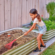 child using a red rake