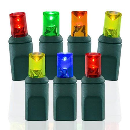 Seven individual multicolored mini LED lights from a set of Multicolor LED Christmas Lights (100 Light) in red, green, orange, yellow, and blue arranged in two rows.